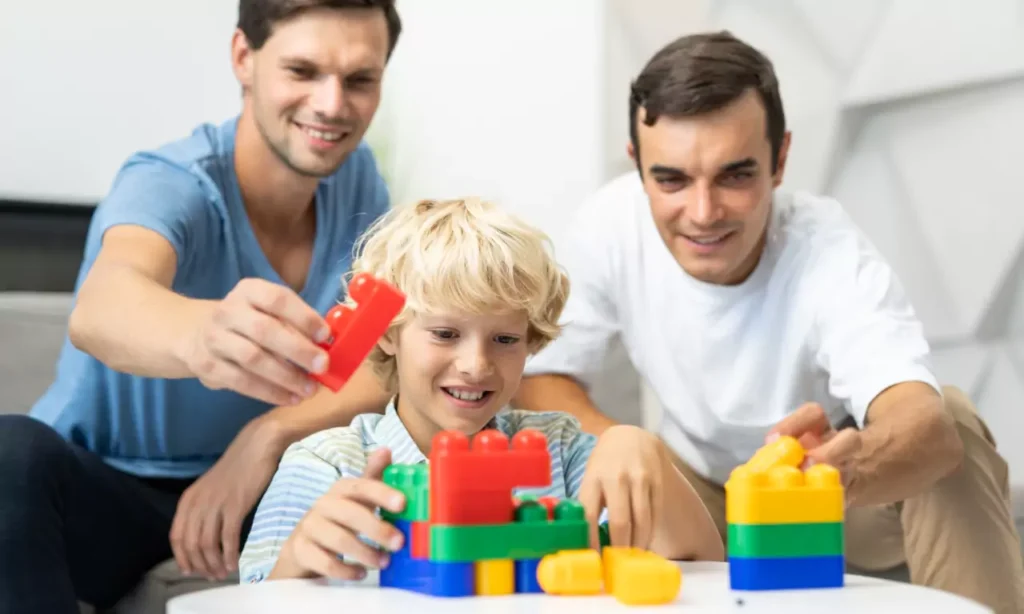 lgbt family gay couple with adopted son